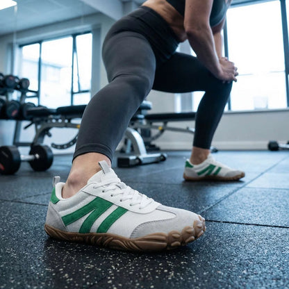 White walking trainers shown on foot