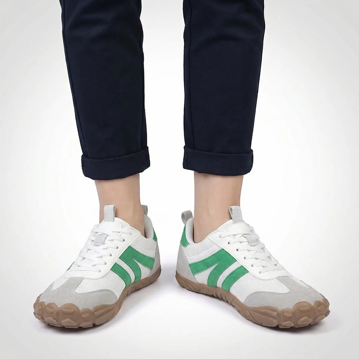 White walking trainers shown on foot