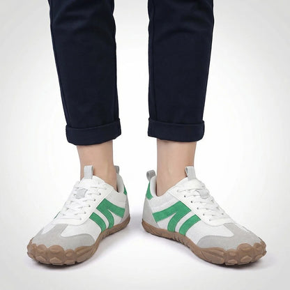 White walking trainers shown on foot