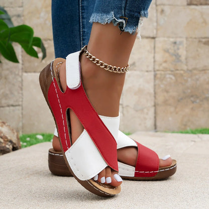 Red and white criss-cross sandals worn outdoors, front and side view
