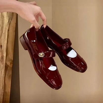 Women's Mary Jane shoes held for a close product view