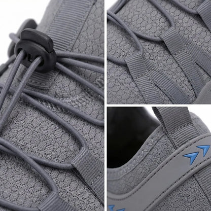 Close-up of grey walking shoe upper, quick-lace toggle and side panel