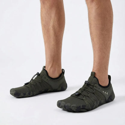 Forest green barefoot walking shoes worn with shorts, side view