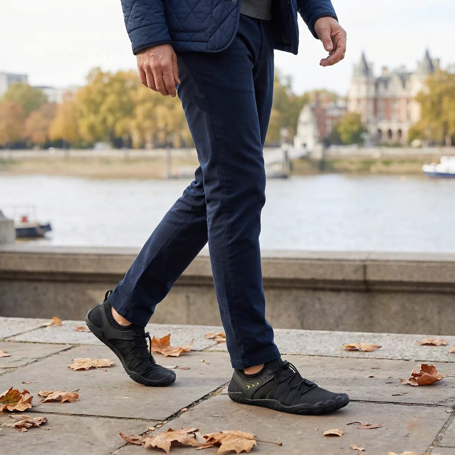 Jet black walking shoes worn during a city walk, side view