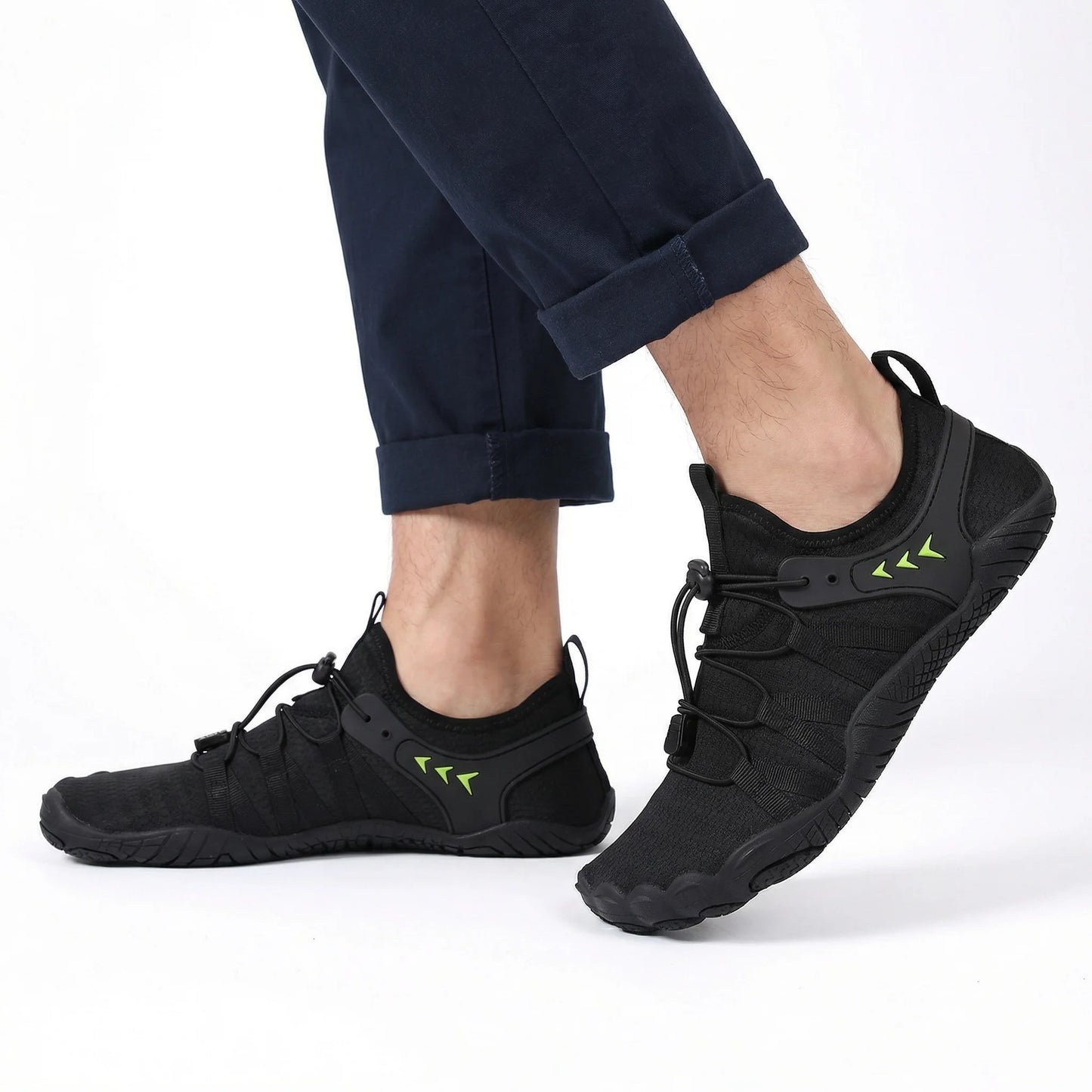 Jet black walking shoes worn with dark trousers, side view