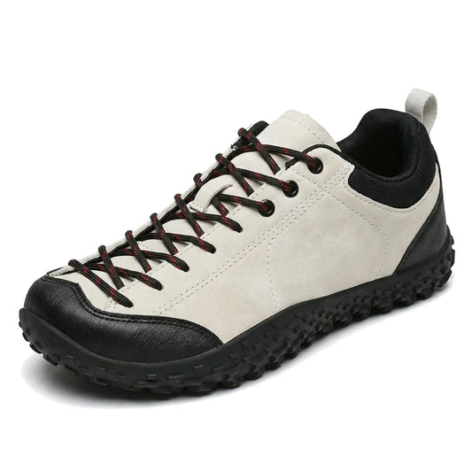 Unisex white and black wide toe box trainers, side profile on a white background
