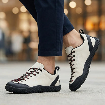 White and black wide toe walking trainers worn from the front