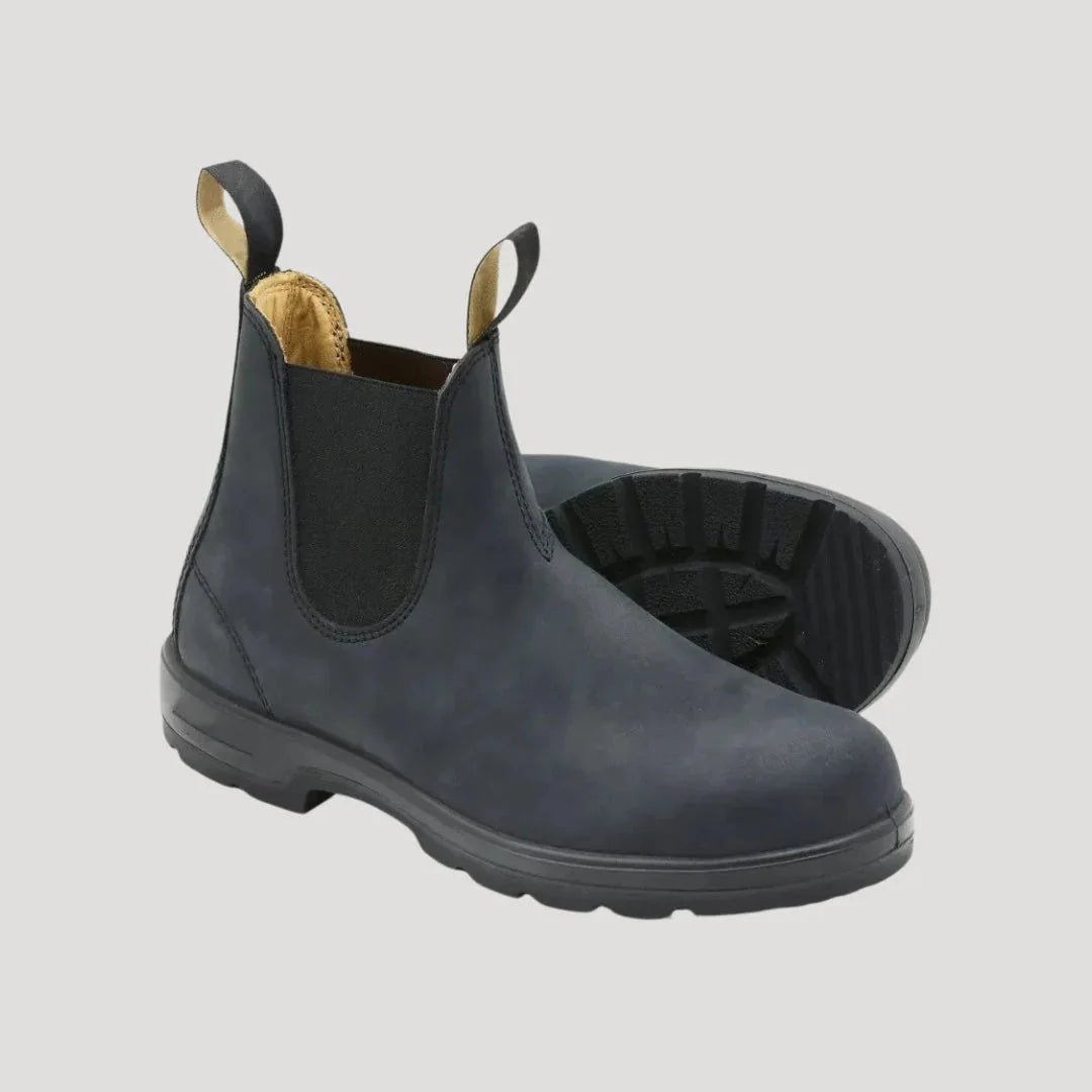 Grey Chelsea boots shown from the side with lug outsole view