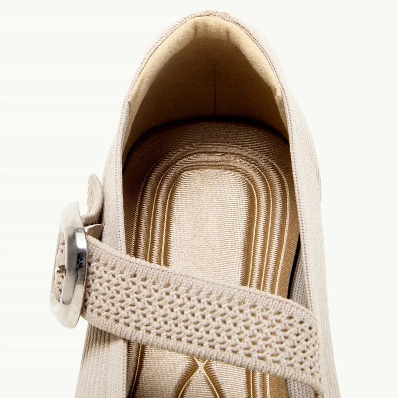 Close-up of the beige knit strap and interior of a square toe Mary Jane flat
