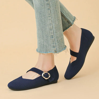 Women's navy square toe Mary Jane flats worn in side profile