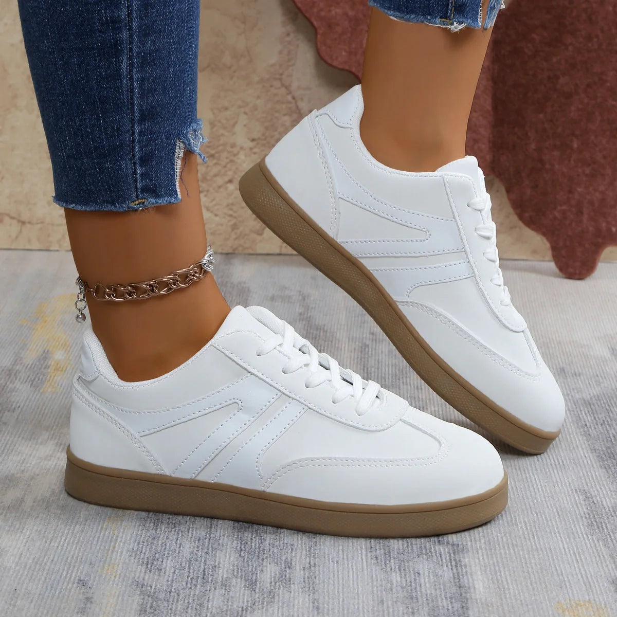 White wide fit trainers for women, side on-foot studio view