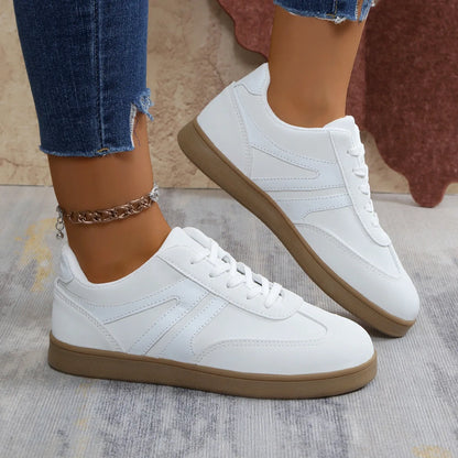 White wide fit trainers for women, side on-foot studio view