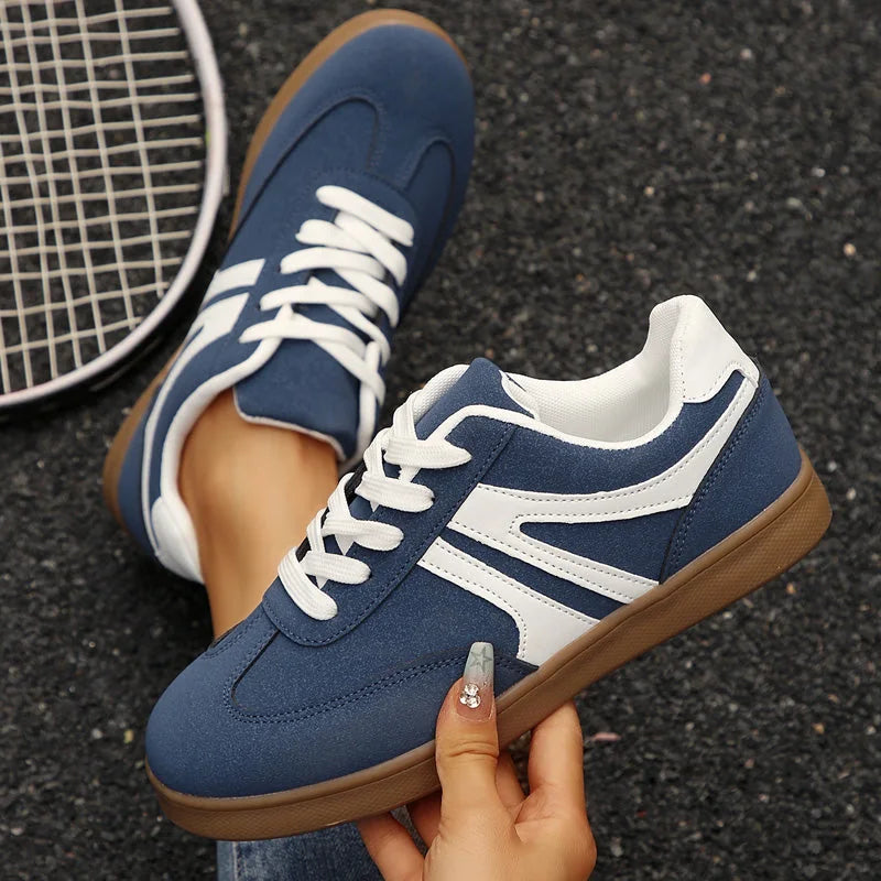 Navy retro trainers for women, top and side hand-held views