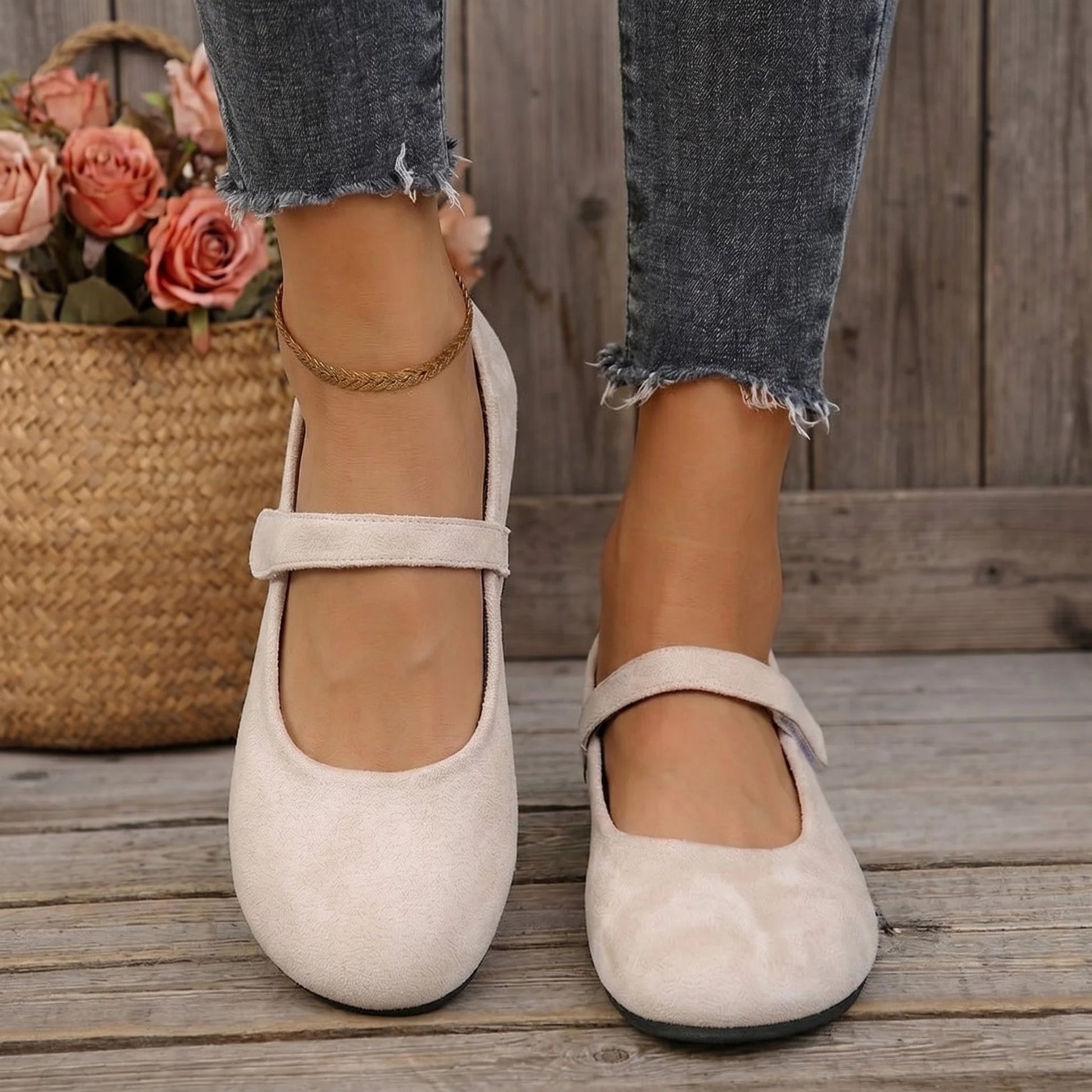 Women's cream wide fit Mary Jane shoes worn from the front