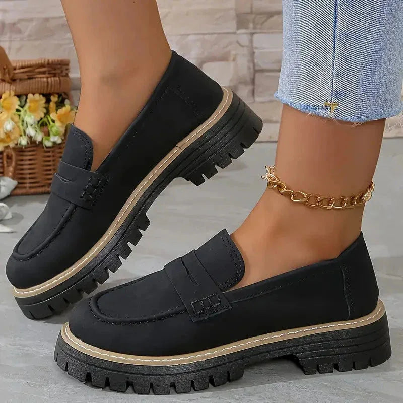 Black chunky loafers for women, on-foot side view