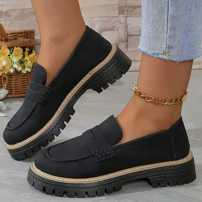 Black chunky loafers for women, on-foot side view