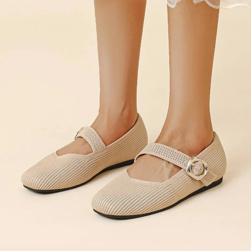Women's beige square toe Mary Jane flats worn from the front