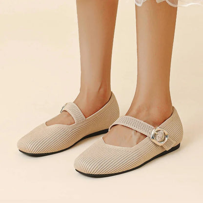 Women's beige square toe Mary Jane flats worn from the front