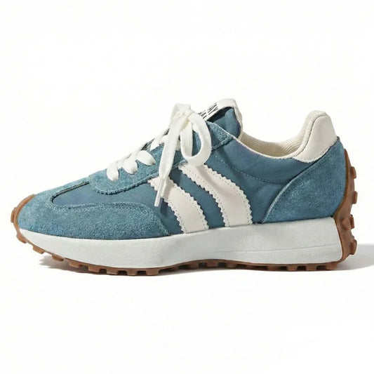 Women's blue and white wide fit trainers, side profile on a white background