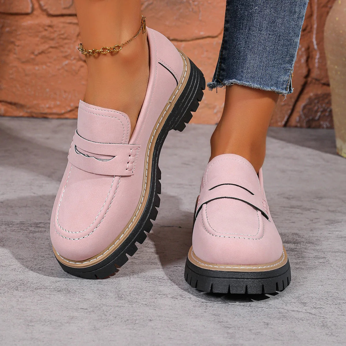 Pink wide fit loafers worn with cropped jeans, front view