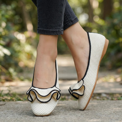 Women's knit slip-on flats shown on foot