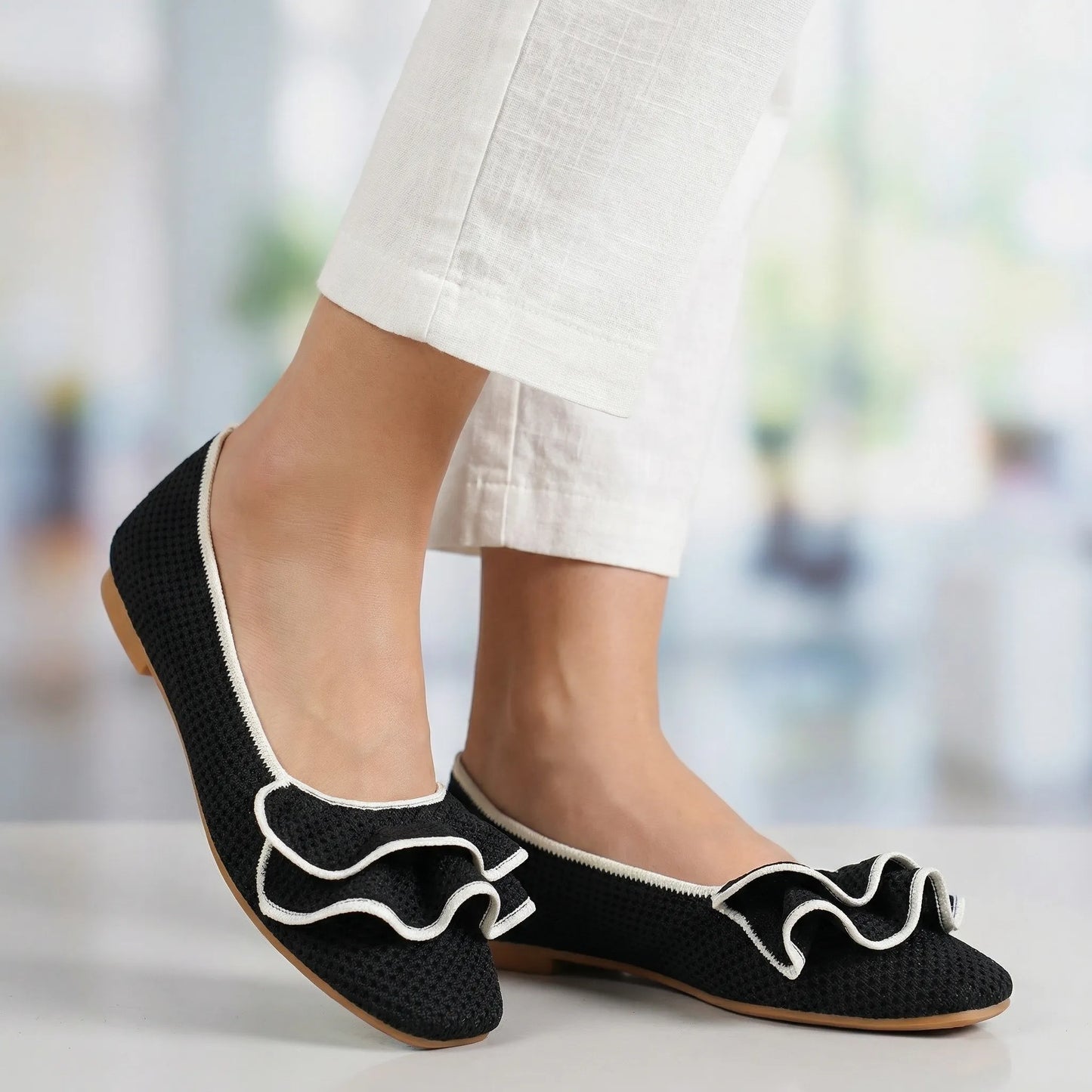 Women's knit slip-on flats shown on foot