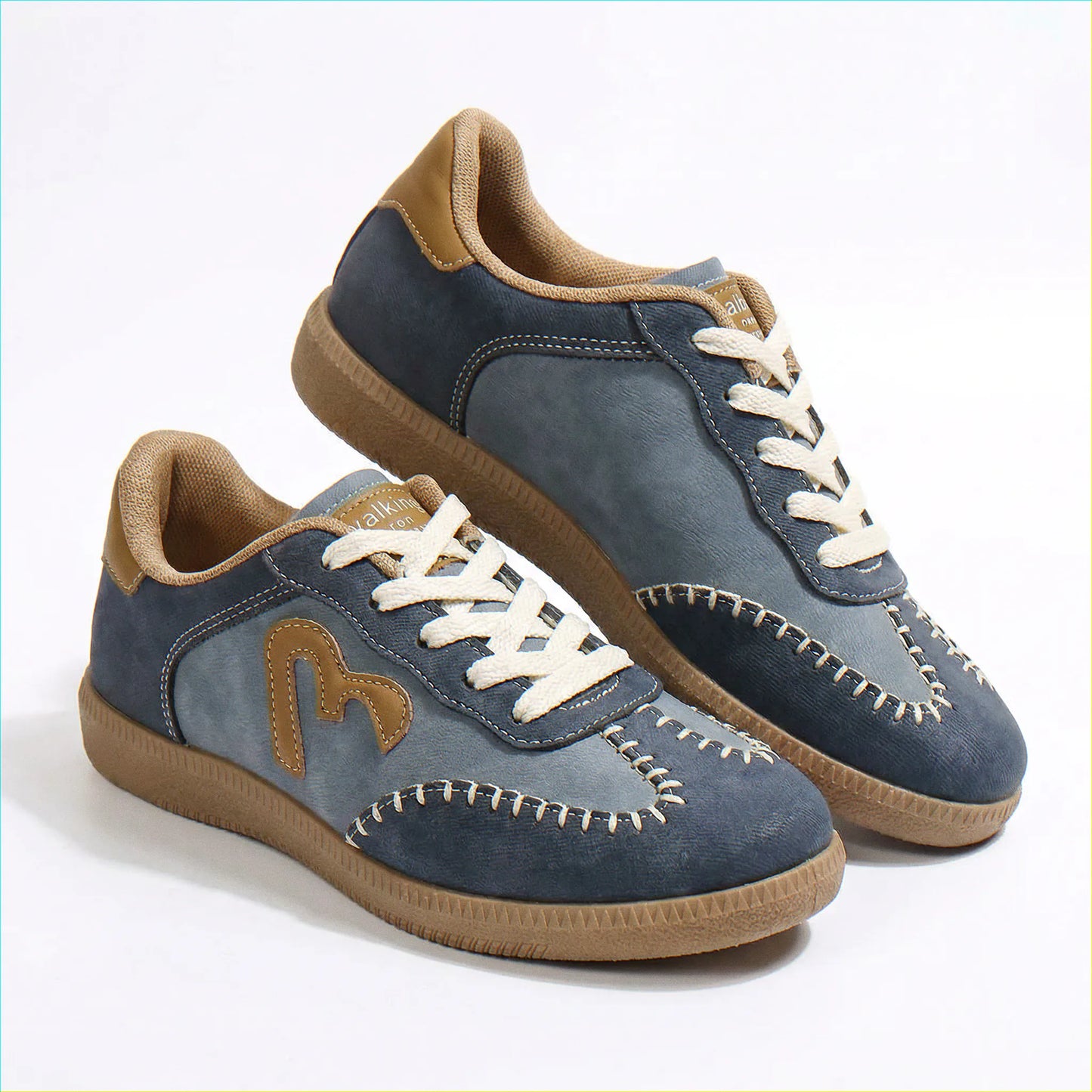Dusty blue wide fit trainers for women, angled studio pair