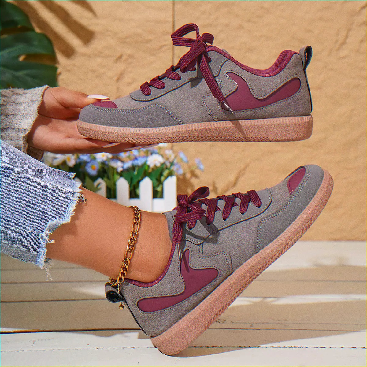 Grey and pink retro trainers for women, close on-foot view