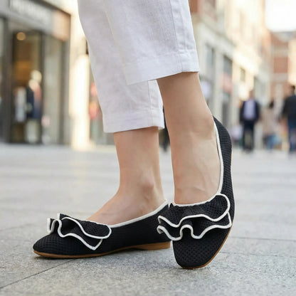 Women's knit slip-on flats shown on foot