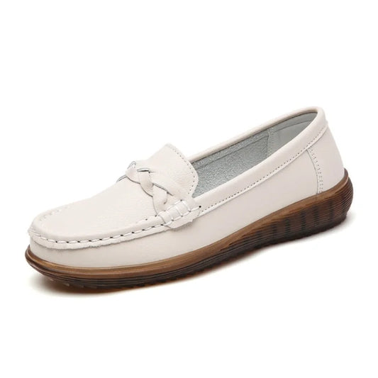 White wide fit loafers for women, side studio view on white background