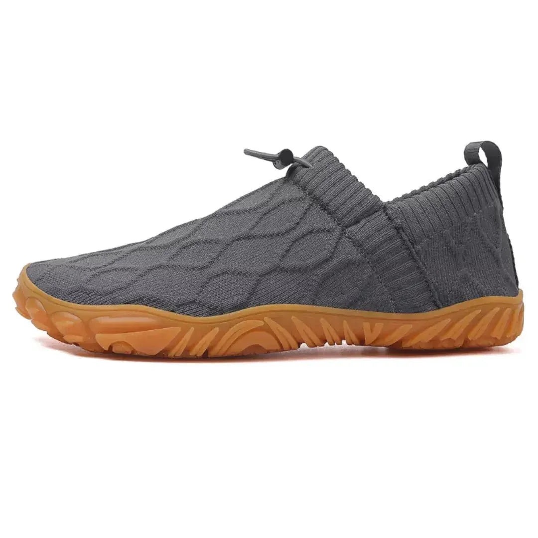 Grey barefoot walking shoes, isolated side studio view