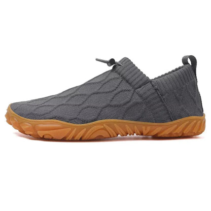 Grey barefoot walking shoes, isolated side studio view