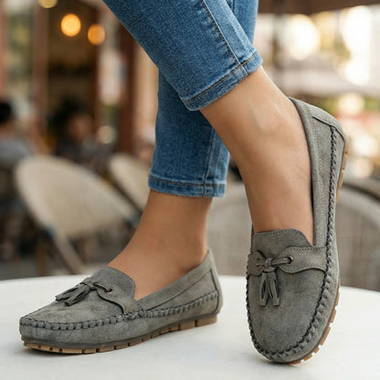 Charcoal grey loafers for women, close on-foot street view